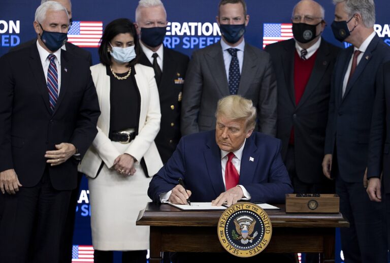 US President Donald Trump signed an executive at the Operation Warp Speed Vaccine Summit on December 08, 2020 in Washington, DC. The president signed an executive order stating the US would provide vaccines to Americans before aiding other nations. (Photo by Tasos Katopodis/Getty Images)