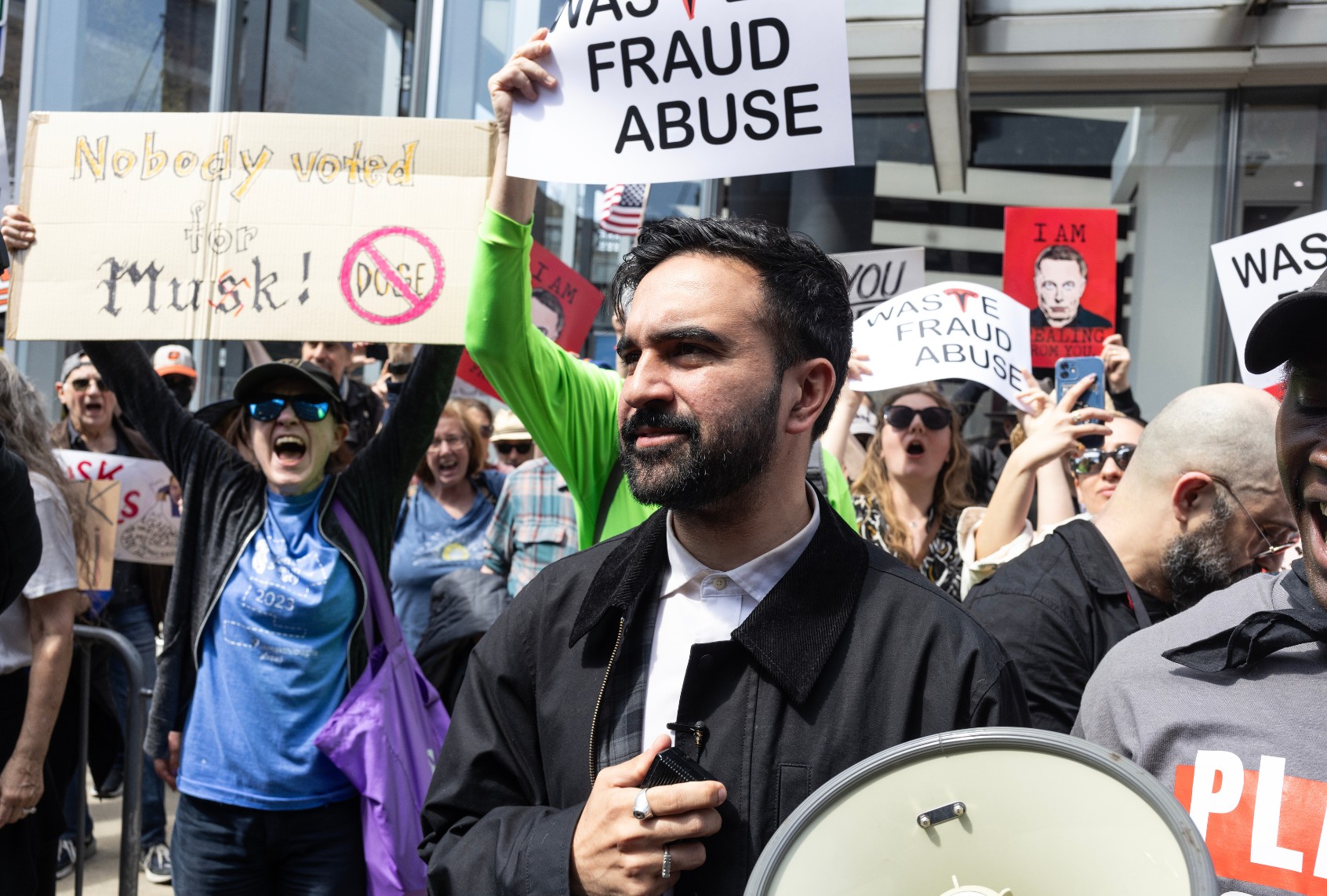 New York City mayoral candidate Zohran Mamdani joins the weekly demonstrations outside of Tesla stores to protest Elon Musk and his role at the Department of Government Efficiency, March 29, 2025, in the West Village neighborhood of New York City. (Andrew Lichtenstein/Corbis via Getty Images)