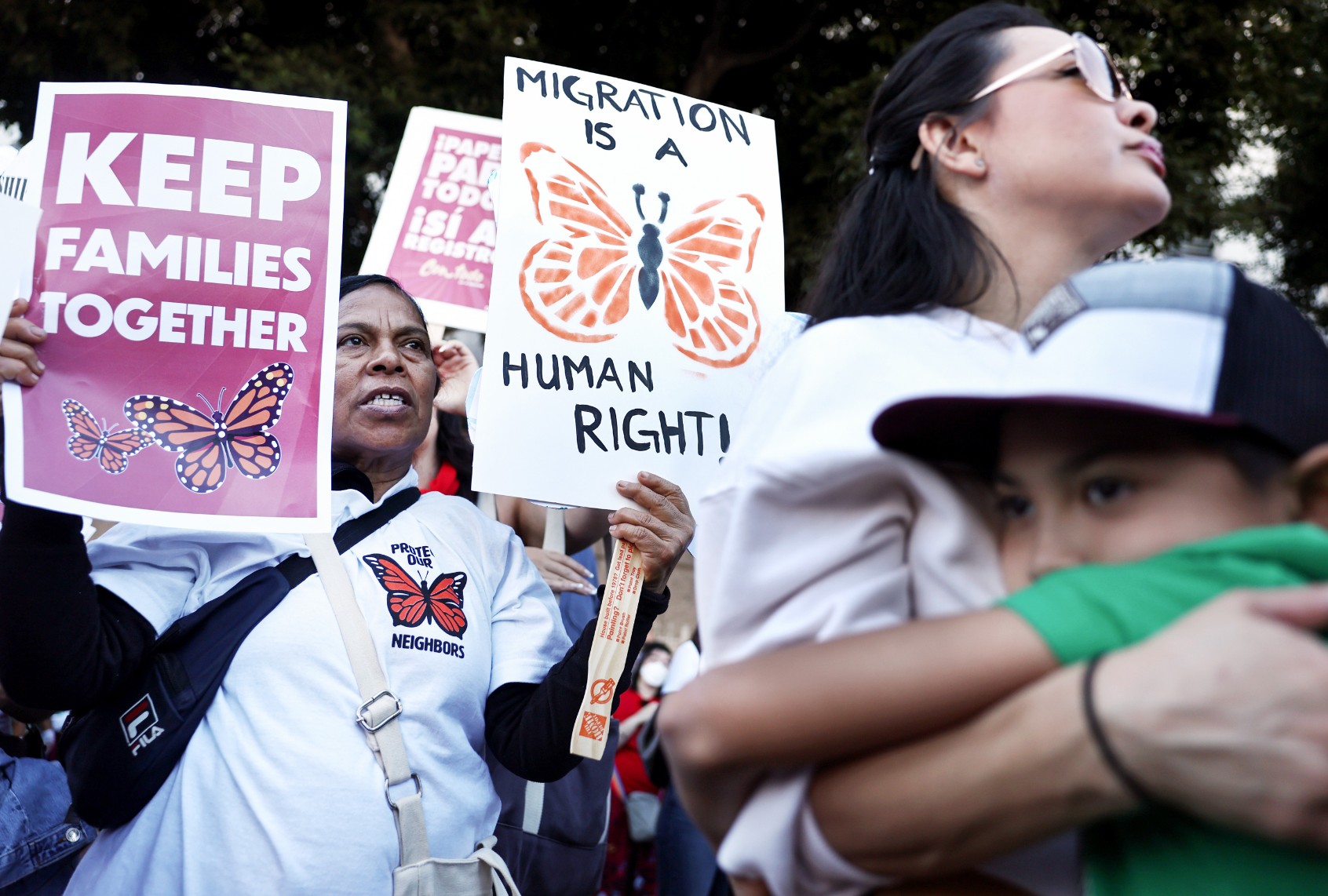 Immigrant rights supporters stand after marching to an ICE detention center on International Migrants Day on December 18, 2024 in Los Angeles, California. (Mario Tama/Getty Images)