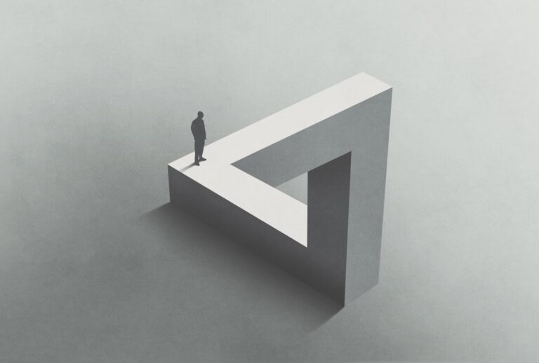 Man walking on Penrose triangle. (Getty Images / francescoch)