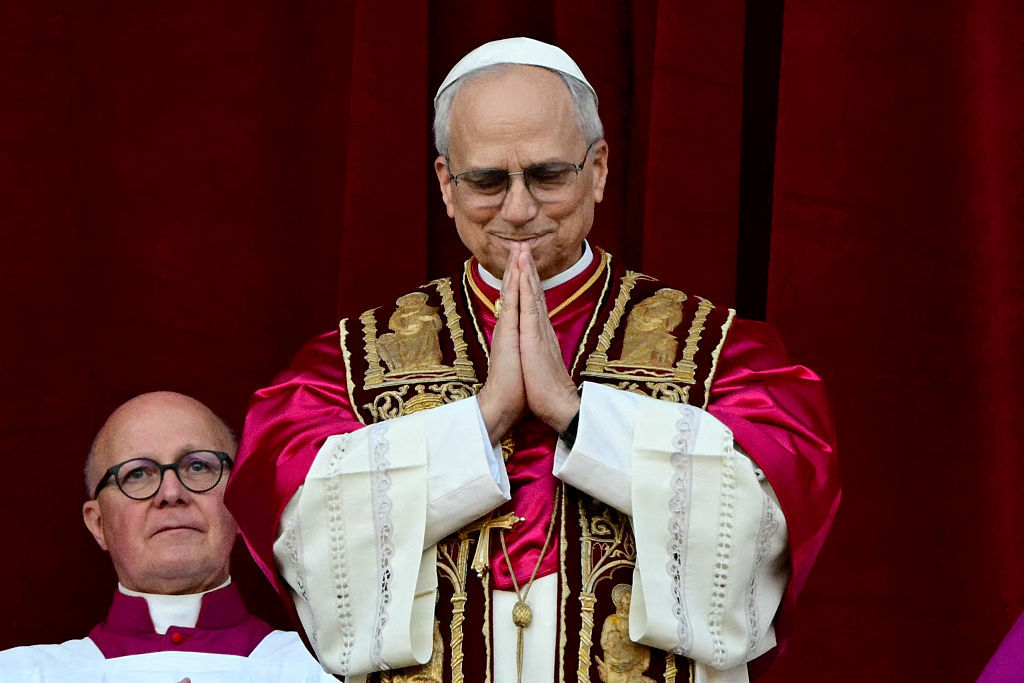 Newly elected Pope Leo XIV, Robert Prevost addresses the crowd from the main central loggia balcony of the St Peter's Basilica for the first time, after the cardinals ended the conclave, in The Vatican, on May 8, 2025 (Getty Images / TIZIANA FABI/AFP)