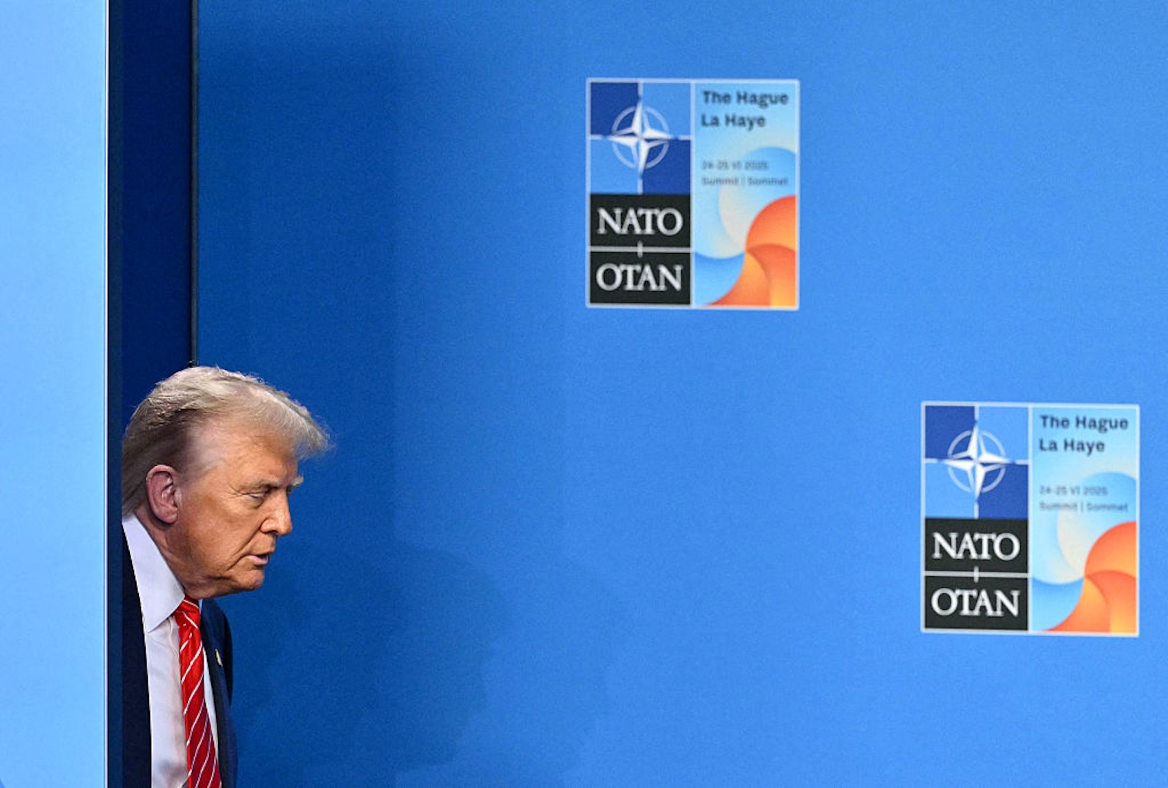President Donald Trump arrives at the NATO Heads of State and Government summit in The Hague, on June 25, 2025. (NICOLAS TUCAT / AFP)
