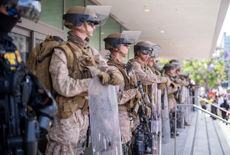 U.S. Marines stand guard outside the Federal Building during a protest against the Trump administration in Los Angeles, June 14, 2025. (Ringo Chiu/AFP via Getty Images)