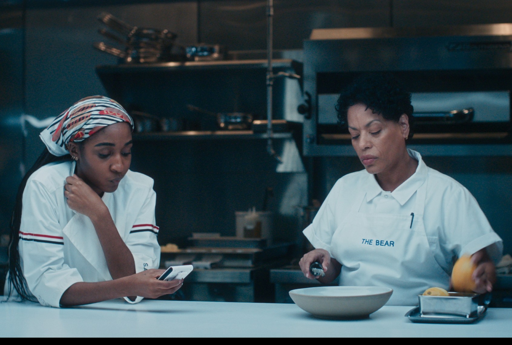 Ayo Edebiri as Sydney "Syd" Adamu and Liza ColÃ³n-Zayas as Tina Marrero in "The Bear" (FX)