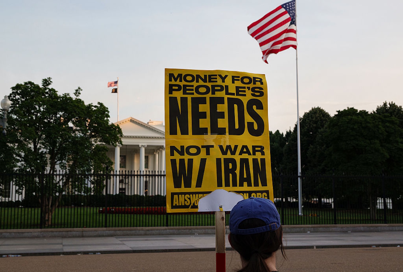 A protester stands outside of the White House the day after President Donald Trump ordered U.S. military strikes on nuclear sites in Iran. (Kevin Carter/Getty Images)