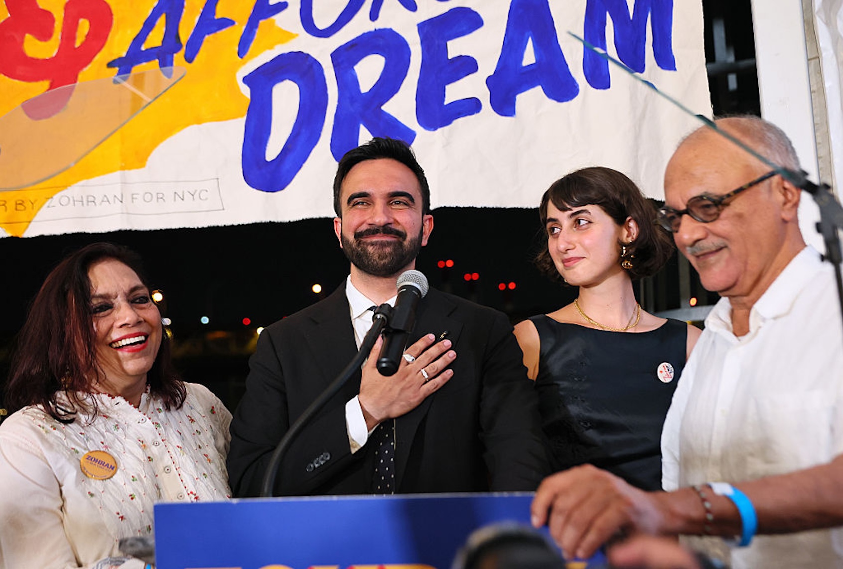 Zohran Mamdani, presumptive Democratic New York City mayoral nominee, celebrates his onstage with Rama Duwaji, Mahmood Mamdani and Mira Nair (Michael M. Santiago/Getty Images)