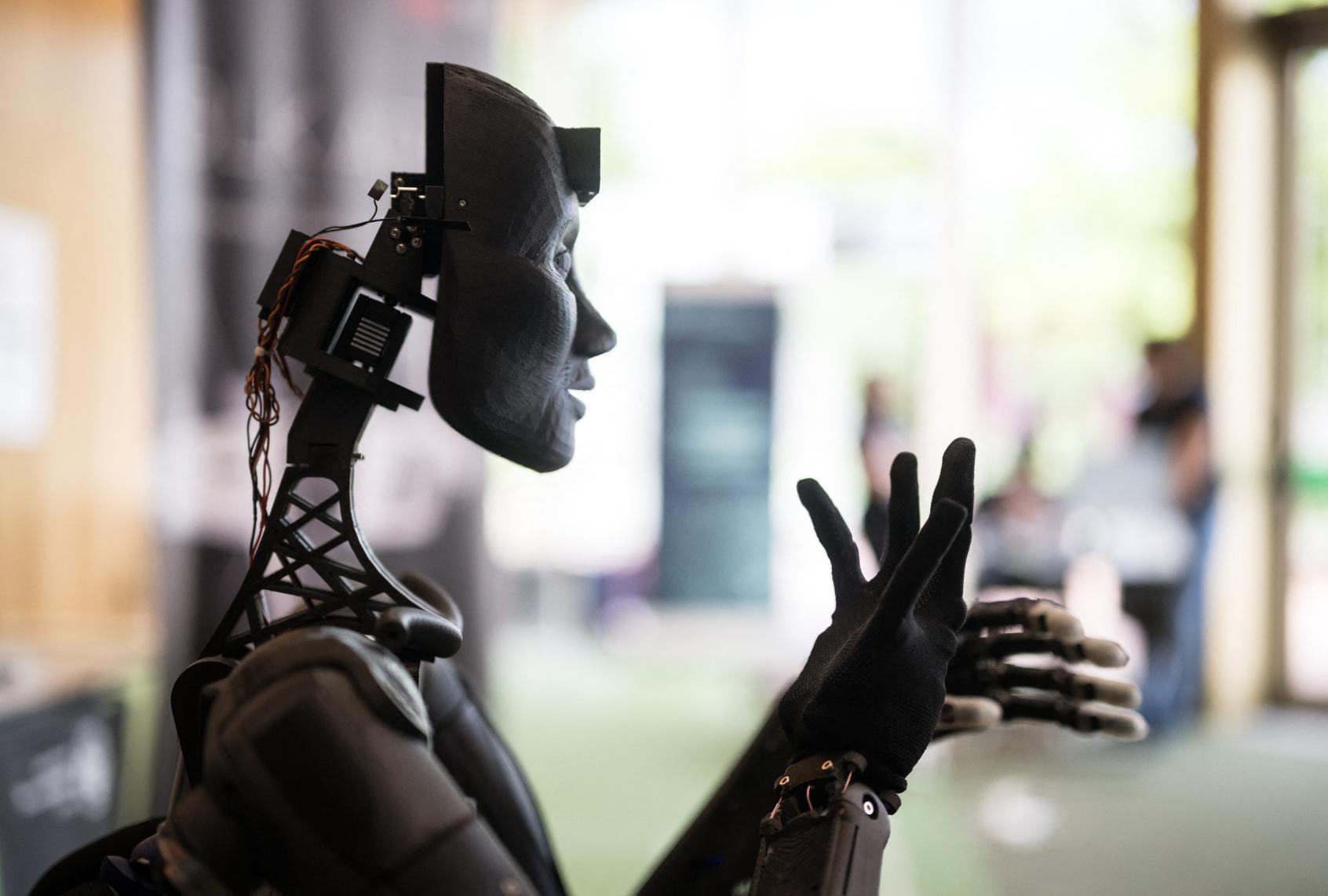 A robot using artificial intelligence is displayed at a stand during the International Telecommunication Union (ITU) AI for Good Global Summit in Geneva, on May 30, 2024. (FABRICE COFFRINI/AFP via Getty Images)