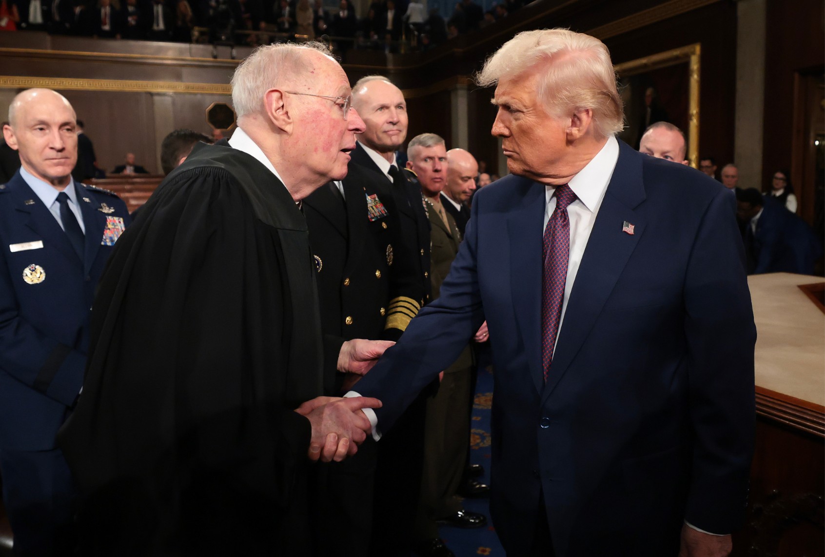 U.S. President Donald Trump shakes hands with retired Supreme Court Justice Anthony Kennedy after addressing a joint session of Congress at the U.S. Capitol on March 04, 2025 in Washington, DC. (Win McNamee/Getty Images)