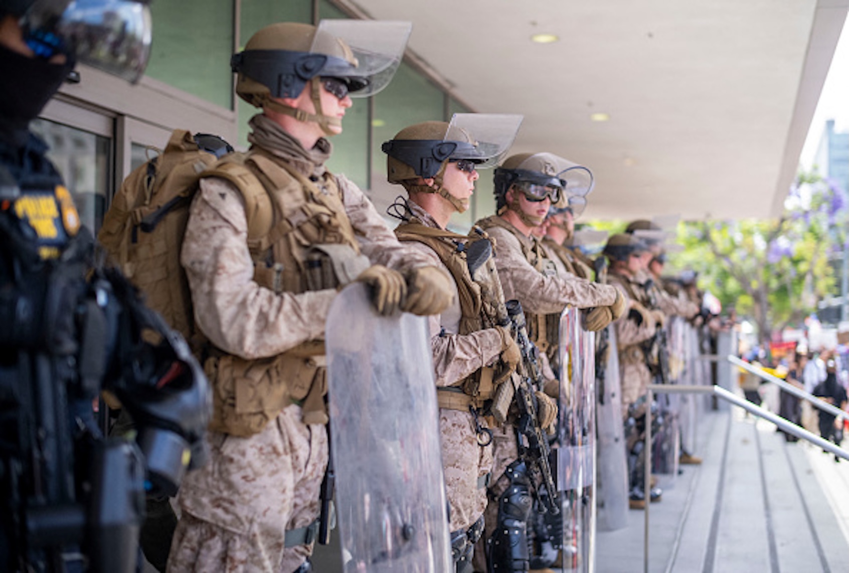 US Marines stand guard outside the Federal Building during a protest against the Trump administration during the "No Kings" national rally in downtown Los Angeles, California, on June 14, 2025, on the same day as President Trump's military parade in Washington, DC. (RINGO CHIU/AFP via Getty Images)