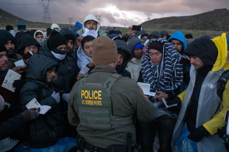 Asylum seekers and border patrol agents at an improvised camp near the U.S.-Mexico border in California, Feb. 2, 2024. (Guillermo Arias/AFP via Getty Images)