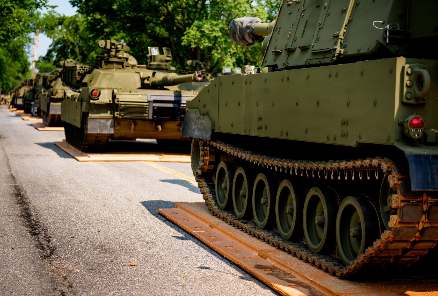 U.S. Army soldiers work on an assortment of M1 Alpha a3 Abrams tanks, stryker armored vehicles, and M2 Bradley fighting vehicles at West Potomac Park along the Potomac River on June 11, 2025 in Washington, DC. (Andrew Harnik/Getty Images)