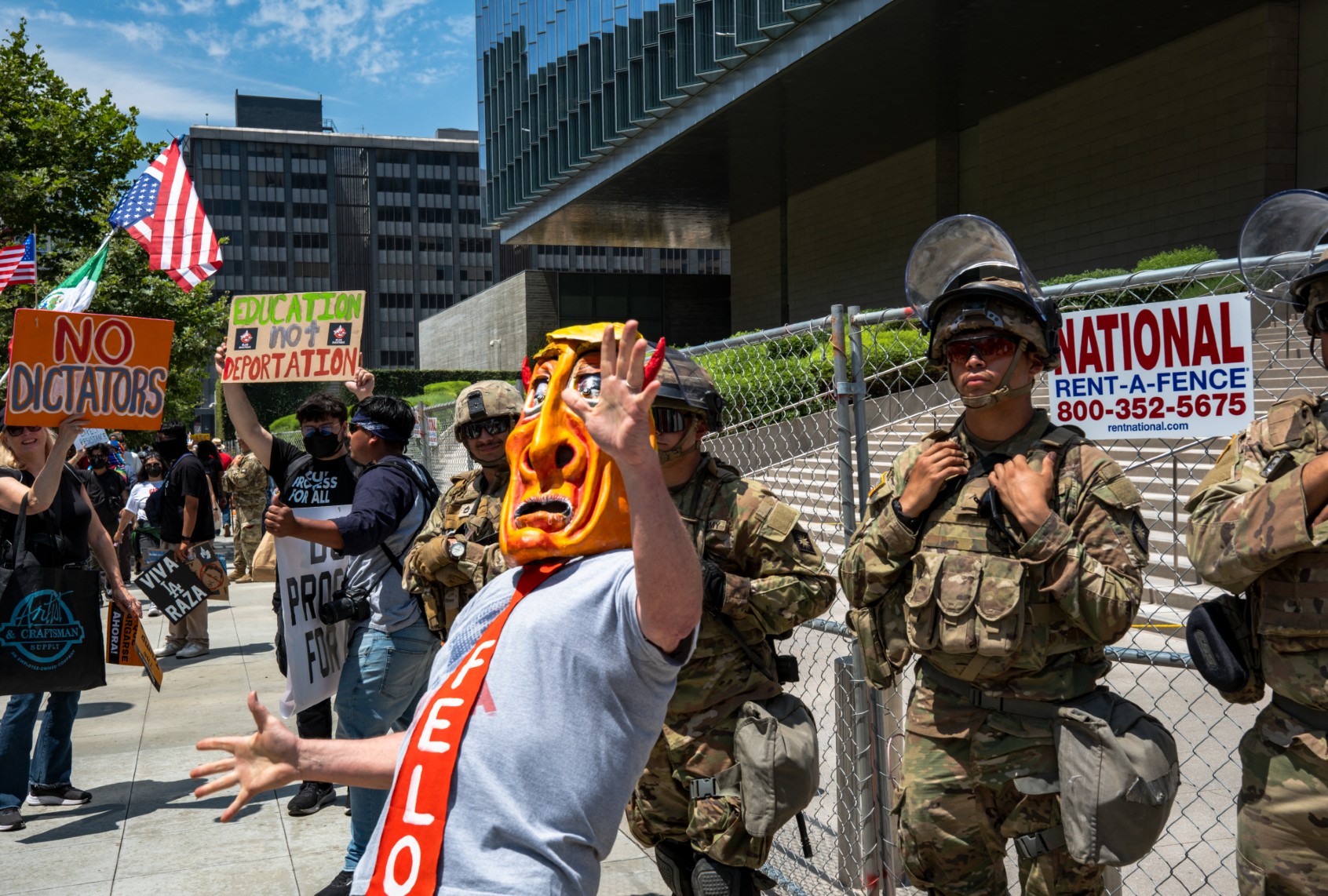 A protester in a Trump mask during the No Kings demonstration in Los Angeles, California, on June 14, 2025. (LAUREN PUENTE/Middle East Images/AFP via Getty Images)