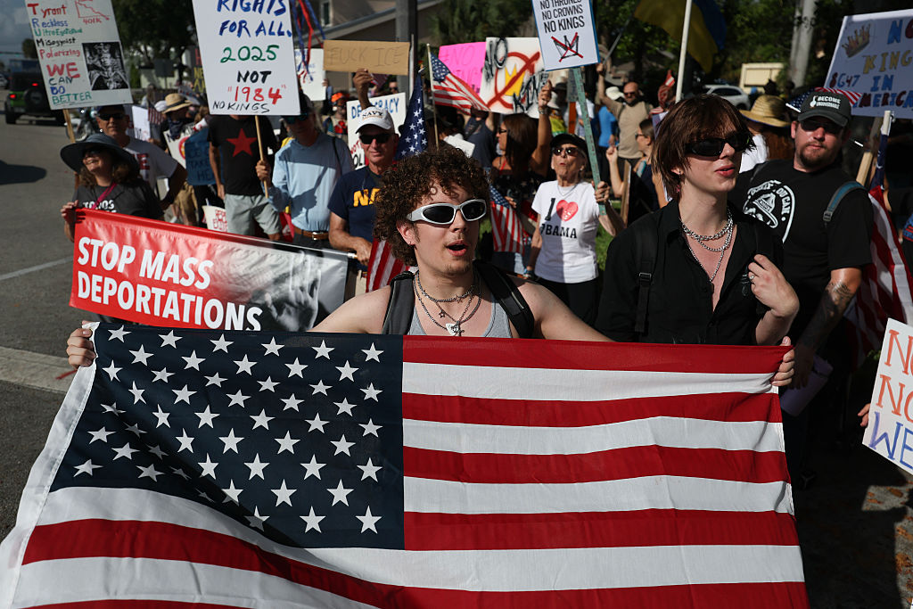 Thousands are turning out for rallies across the U.S. to protest President Trump, while Trump celebrates his birthday tonight in D.C. with a military parade. (Joe Raedle / Getty Images)
