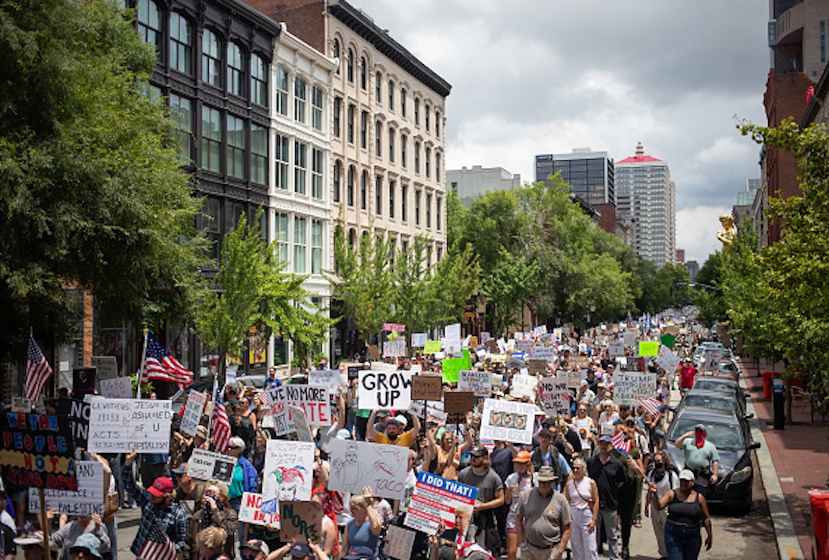 Protesters march during a nationwide "No Kings" rally in downtown Louisville, Kentucky, on June 14, 2025, on the same day as President Donald Trump's military parade in Washington, DC. Thousands of people rallied across the United States on June 14 as a so-called "No Kings" has sprung up against the policies of US President Donald Trump, ahead of a rare military parade on his 79th birthday. (LEANDRO LOZADA/AFP via Getty Images)