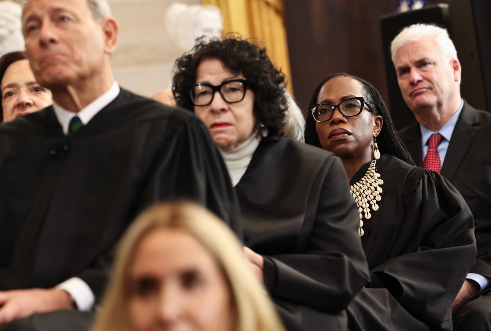 WASHINGTON, DC - JANUARY 20: (L-R) U.S. Supreme Court Chief Justice John Roberts, U.S. Supreme Court Associate Justice Sonia Sotomayor and U.S. Associate Supreme Court Justice Ketanji Brown Jackson listen as U.S. President Donald Trump speaks during inauguration ceremonies in the Rotunda of the U.S. Capitol on January 20, 2025 in Washington, DC.