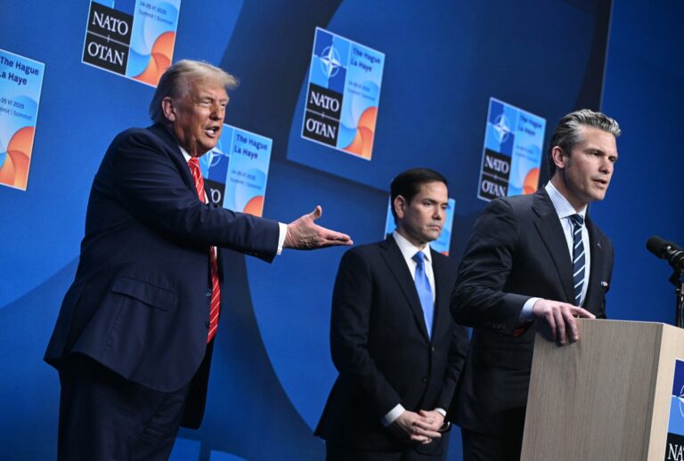 US President Donald Trump (L) reacts as US Defense Secretary Pete Hegseth (R) speaks flanked by US Secretary of State Marco Rubio (C) at a press conference during a North Atlantic Treaty Organization (NATO) Heads of State and Government summit in The Hague on June 25, 2025. (BRENDAN SMIALOWSKI/AFP via Getty Images)