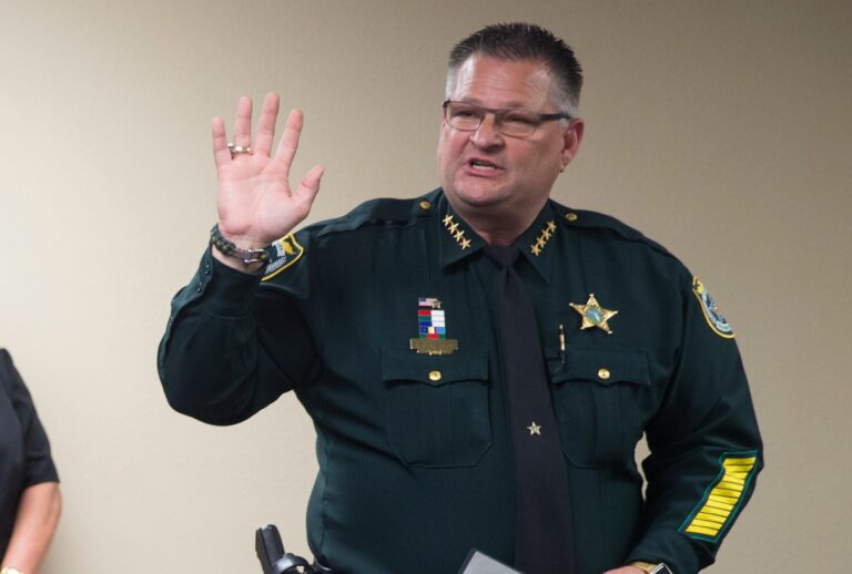 Brevard County Sheriff Wayne Ivey raises his right hand to swear in several officers on November 1, 2017 in Titusville, Florida. (Willie J. Allen Jr. for The Washington Post via Getty Images)