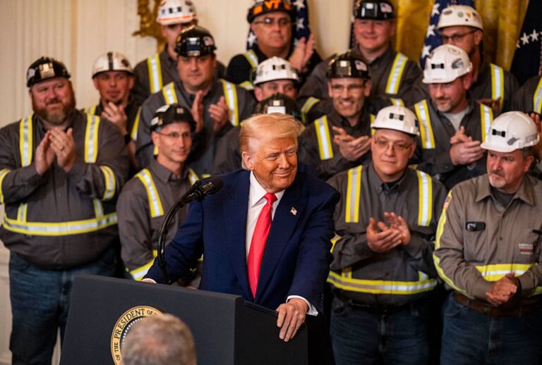 Flanked by industry workers, President Donald Trump speaks at a White House signing ceremony for executive orders to revive clean coal technology. (ANDREW THOMAS/Middle East Images/AFP via Getty Images)