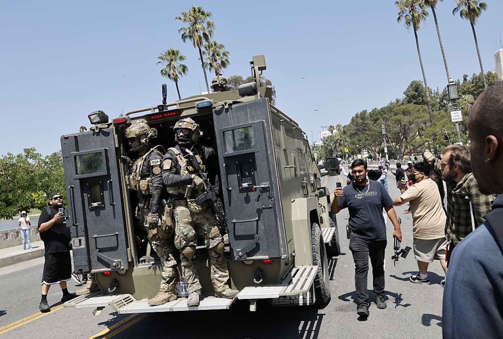 Federal immigration agents near MacArthur Park in Los Angeles on July 7, 2025. (Carlin Steihl/Los Angeles Times via Getty Images)