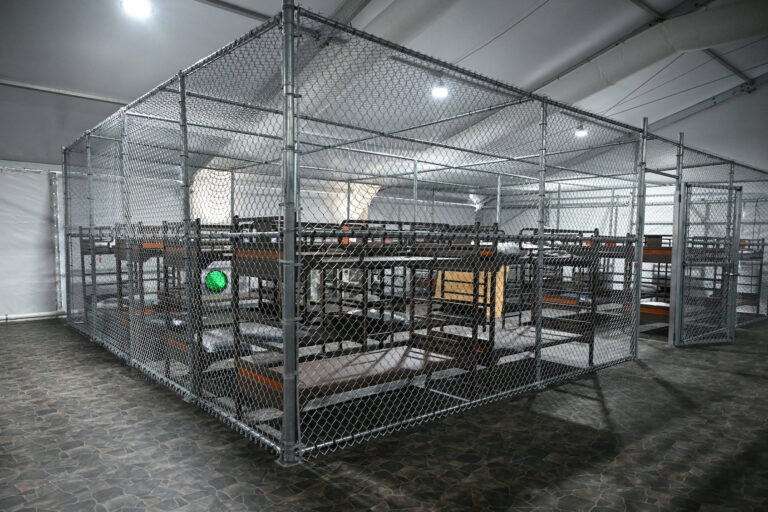 Beds are seen inside a migrant detention center, dubbed "Alligator Alcatraz," located at the site of the Dade-Collier Training and Transition Airport. (Photo by Andrew Caballero-Reynolds/Getty Images)