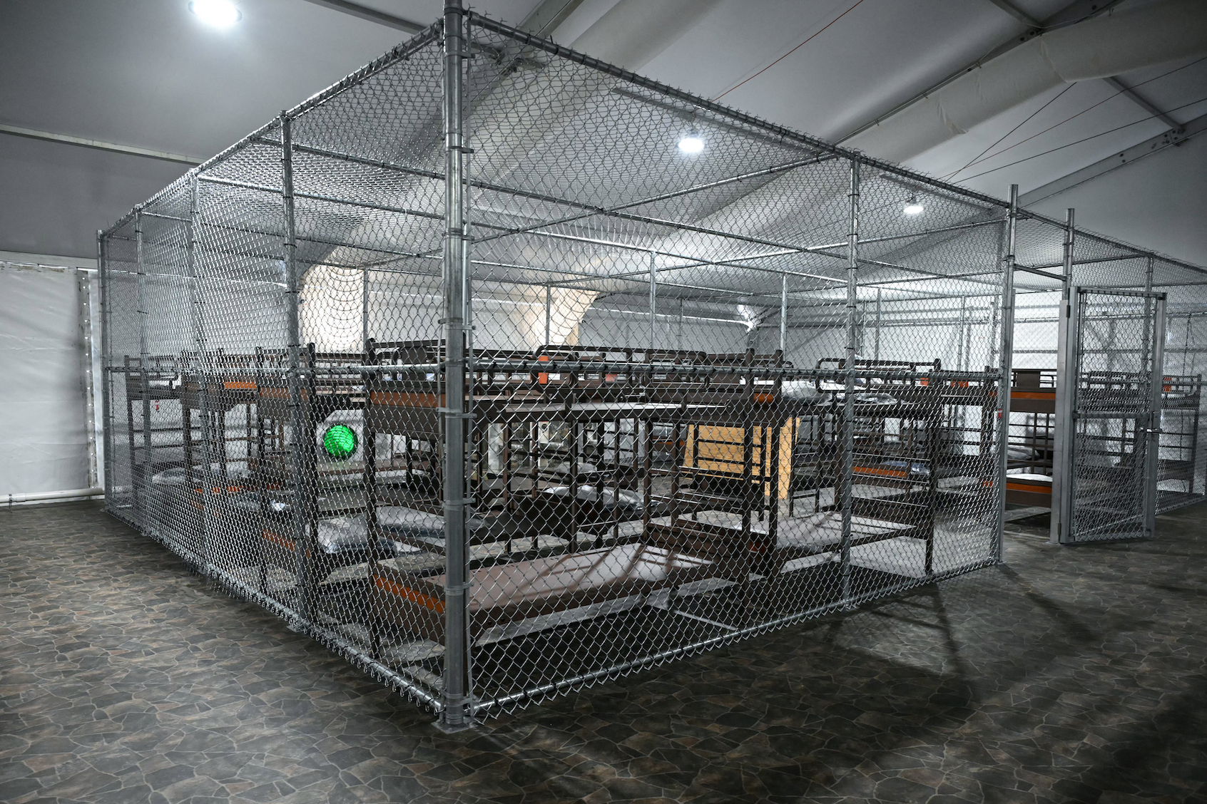 Beds are seen inside a migrant detention center, dubbed "Alligator Alcatraz," located at the site of the Dade-Collier Training and Transition Airport. (Photo by Andrew Caballero-Reynolds/Getty Images)
