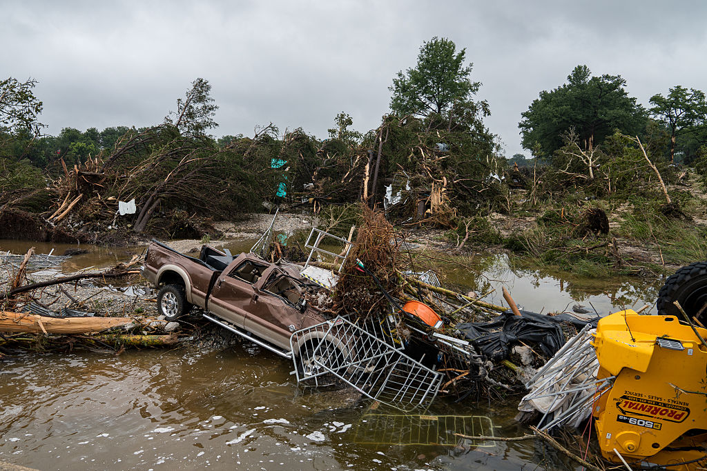 Rescuers battle debris and weather to rescue survivors and recover the lost. 12 campers are still missing, and 70 are dead, including 21 children. ( Eric Vryn / Getty Images)