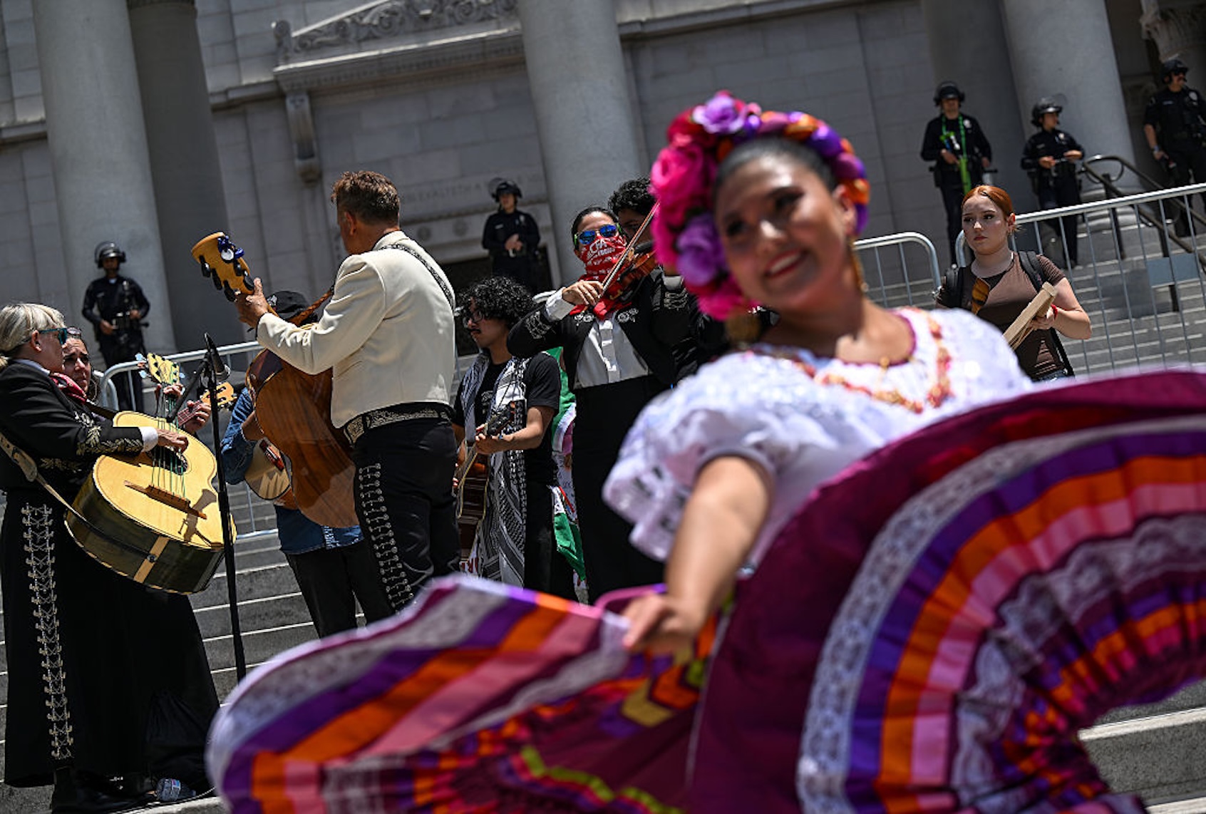 Mariachi players and ballet folklórico dancers perform on June 11, 2025 to support families who have been affected by the recent ICE raids and arrests in Los Angeles. (Joshua Lott/The Washington Post via Getty Images)