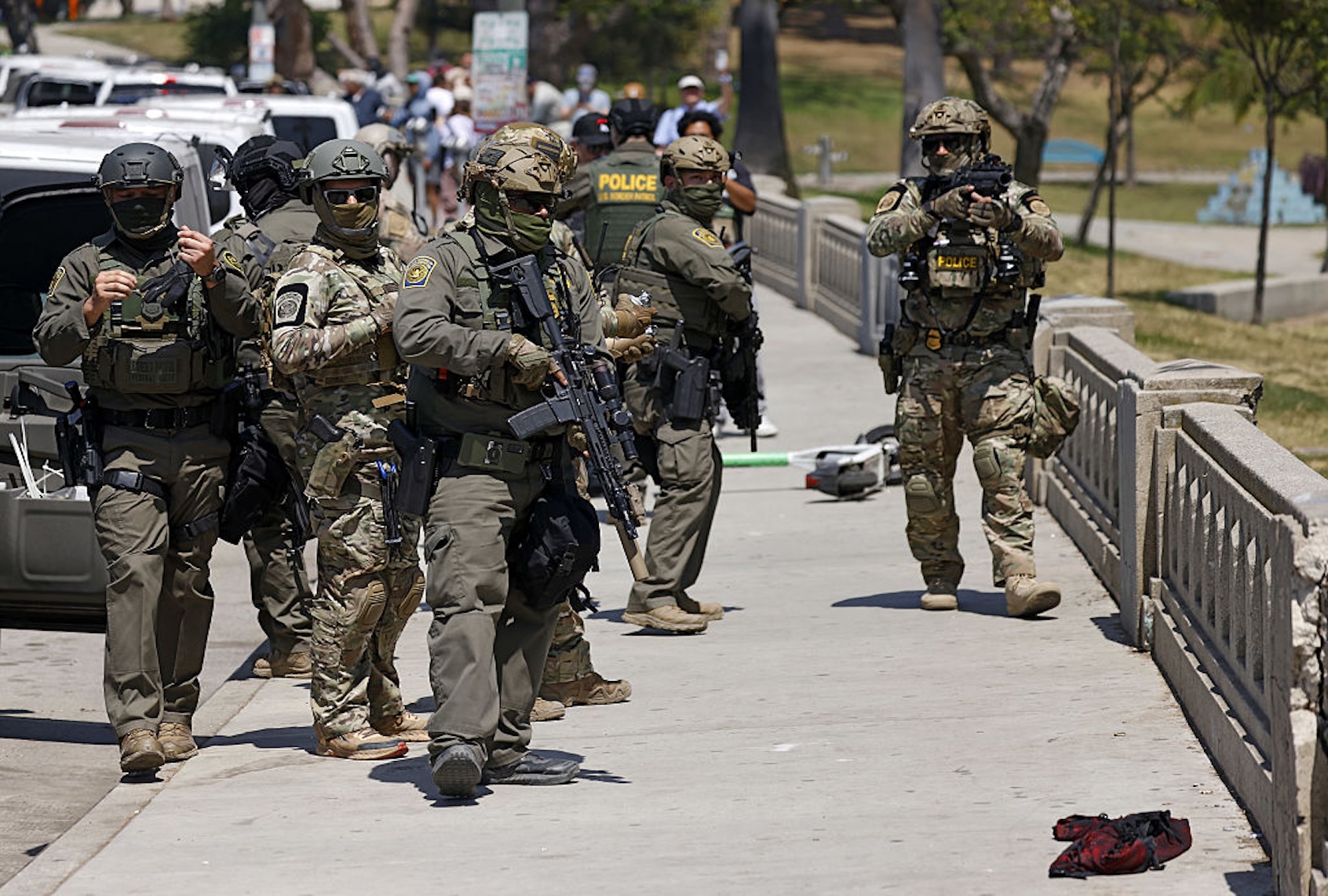 Federal immigration agents near MacArthur Park in Los Angeles on July 7, 2025. (Carlin Steihl/Los Angeles Times)