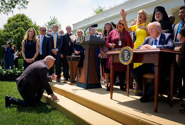 Religious leaders and GOP politicians sing and pray around President Donald Trump during a National Day of Prayer event in the Rose Garden on May 1, 2025. (Andrew Harnik/Getty Images)