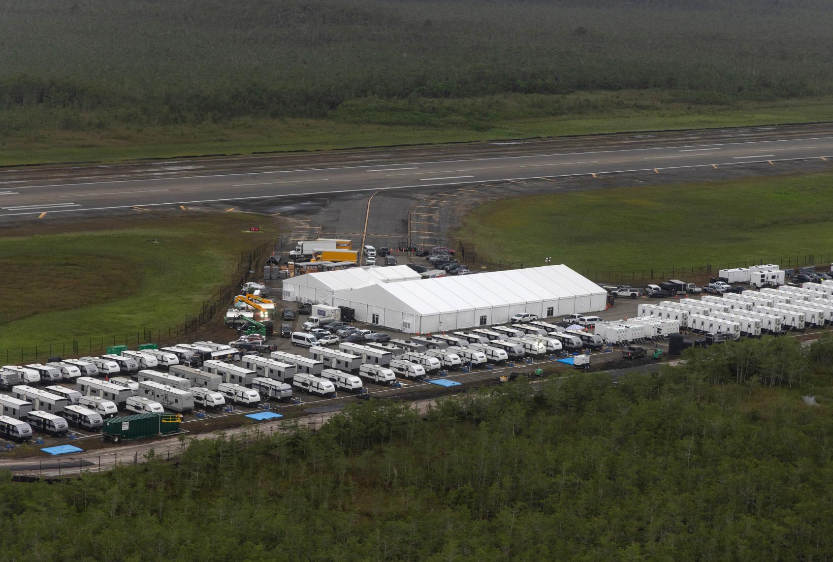 In an aerial view from a helicopter, the migrant detention center, dubbed "Alligator Alcatraz," is seen located at the site of the Dade-Collier Training and Transition Airport on July 4, 2025 in Ochopee, Florida. (Alon Skuy/Getty Images)
