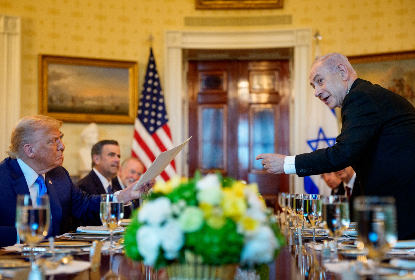 Israeli Prime Minister Benjamin Netanyahu hands off a letter he sent to nominate President Donald Trump for the Nobel Peace Prize in the Blue Room of the White House on July 07, 2025 in Washington, DC. (Andrew Harnik/Getty Images)