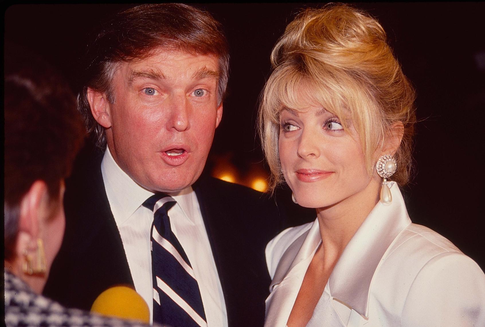 View of American couple, real estate developer Donald Trump and actress Marla Maples as they are interviewed at 'The Prince of Tides' opening, New York, New York, December 9, 1991. (Sonia Moskowitz/Getty Images)