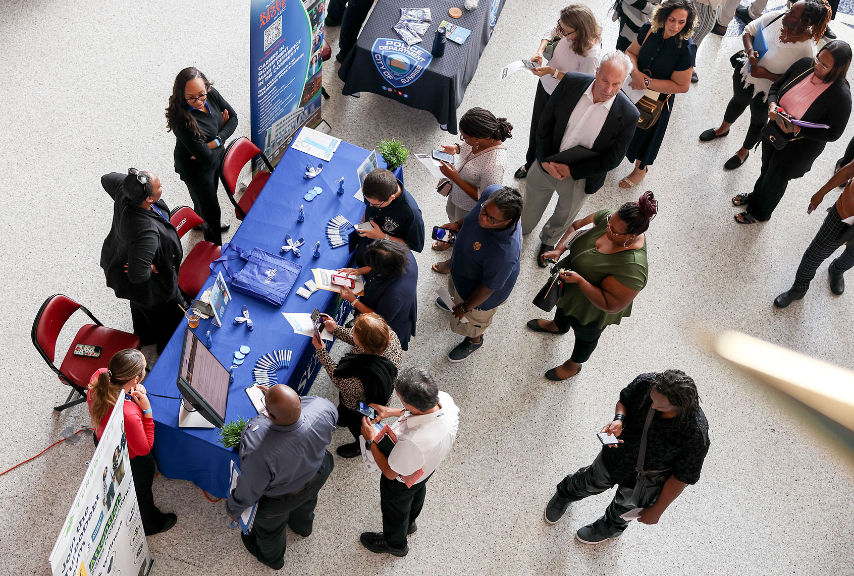 People visit the City of Sunrise booth at the Mega JobNewsUSA South Florida Job Fair at the Amerant Bank Arena on April 30, 2025 in Sunrise, Florida (Joe Raedle/Getty Images)