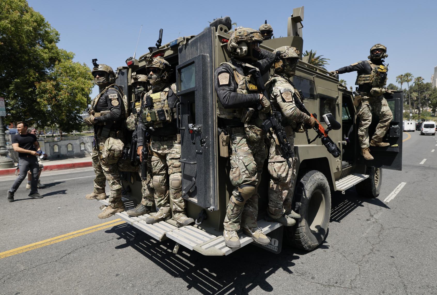 Federal immigration agents near MacArthur Park in the Westlake area on July 7, 2025. (Carlin Steihl/Los Angeles Times via Getty Images)