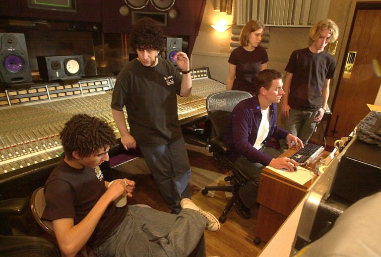 Producer Bill Cutler, center, directs Dylan DiMartini as they mix a guitar solo at the Record Plant studios in Sausalito, California on August 13 ,2003. (Frankie Frost/MediaNews Group/Marin Independent Journal via Getty Images)