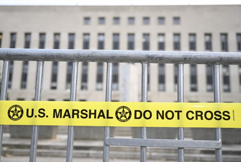 A court building is seen behind a crowd control barrier ahead of then-former President Donald Trump's arrival to answer charges of conspiring to overturn the 2020 election, in Washington, United States on August 3, 2023. (Celal Gunes/Anadolu Agency via Getty Images)