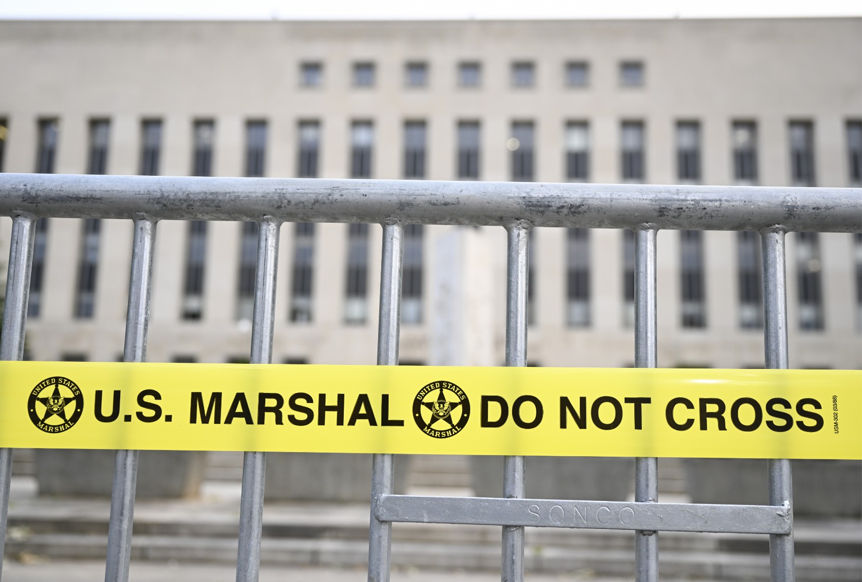 A court building is seen behind a crowd control barrier ahead of then-former President Donald Trump's arrival to answer charges of conspiring to overturn the 2020 election, in Washington, United States on August 3, 2023. (Celal Gunes/Anadolu Agency via Getty Images)