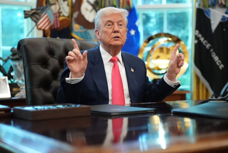 President Donald Trump answers questions from reporters in the Oval Office. (Andrew Harnik/Getty Image)