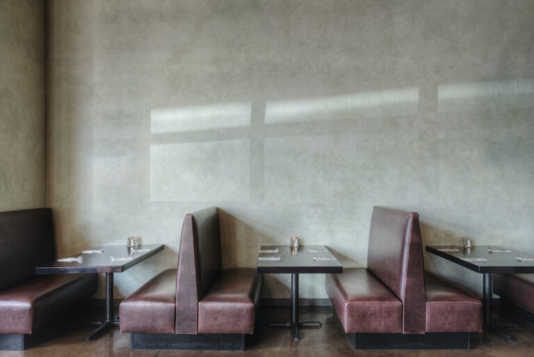 Tables and chairs in empty restaurant (Mint Images / Getty Images )