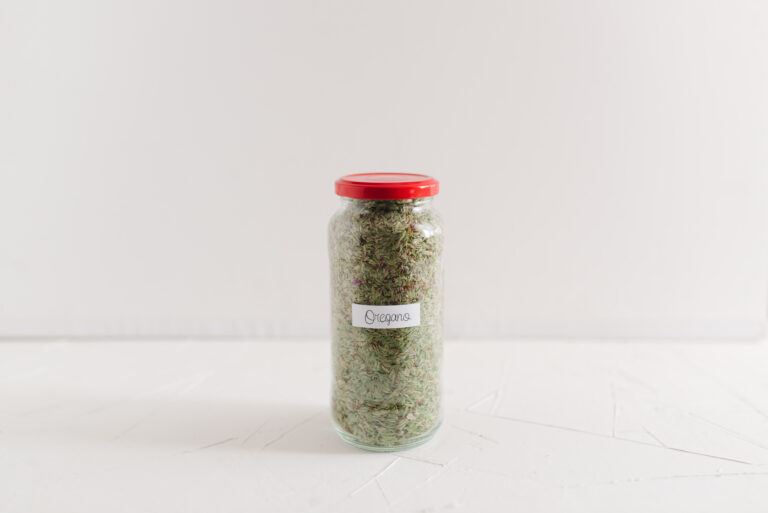 Front view of a glass jar with dried oregano. Food ingredients and spices concept. (Israel Sebastian / Getty Images)