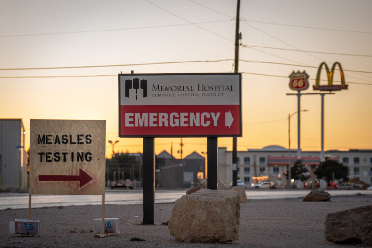 Signs point the way to measles testing in the parking lot of the Seminole Hospital District across from Wigwam Stadium on February 27, 2025 in Seminole, Texas. (Photo by Jan Sonnenmair/Getty Images)