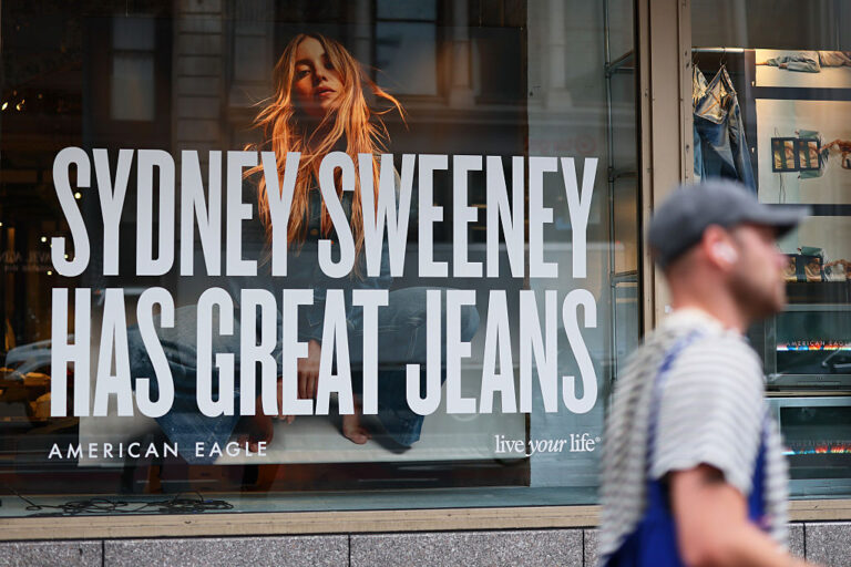 An American Eagle store window features the brand’s “Great Jeans” campaign with Sydney Sweeney, which has drawn both praise and criticism online. (Michael M. Santiago / Getty Images)
