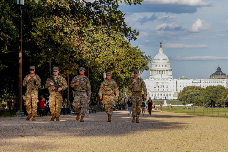 Following the DC takeover, Trump sets his eye on other blue cities, especially the "sanctuary cities." In response, DOJ staff are resigning in protest. (MEHMET ESER / Getty Images)