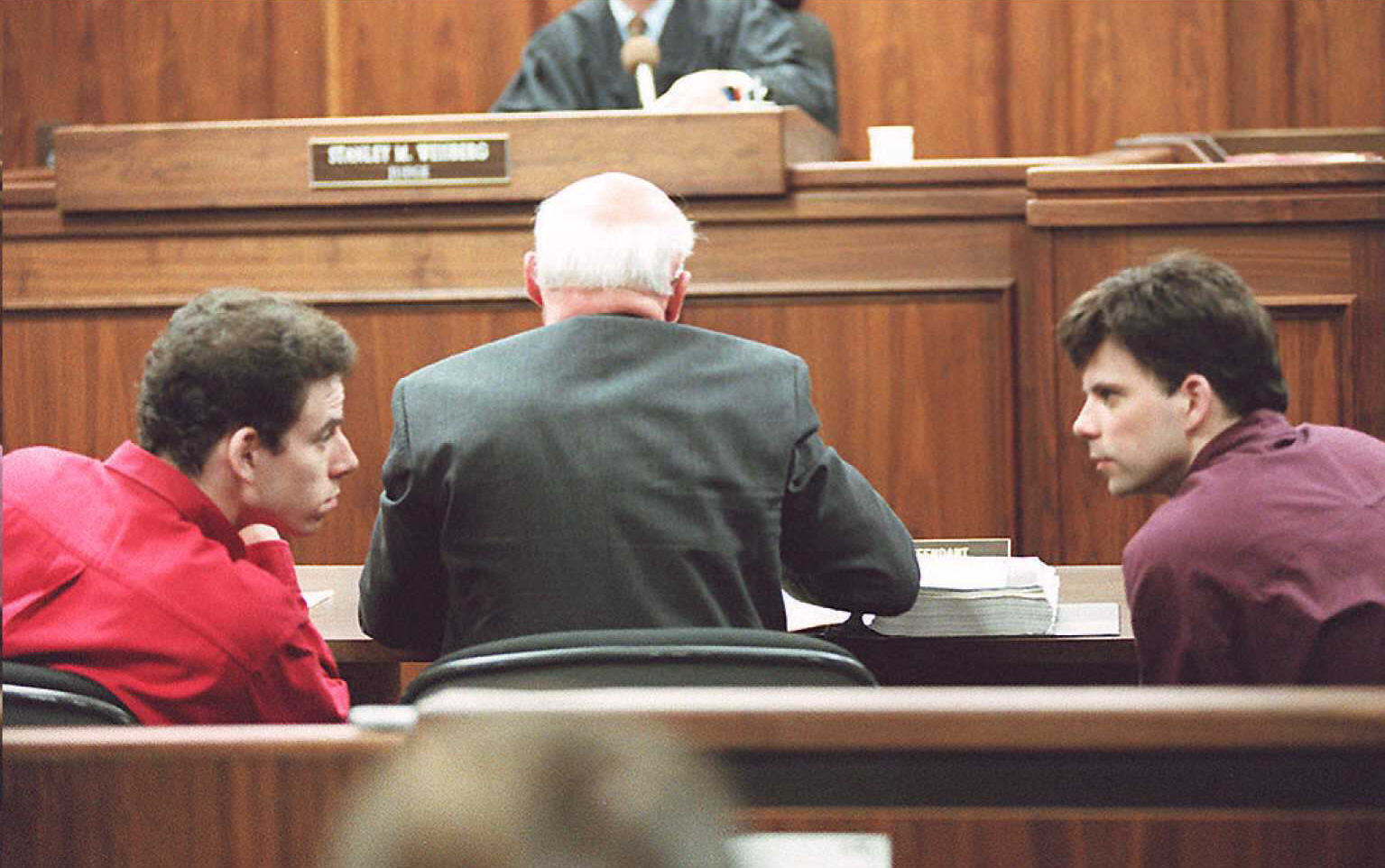 In 1996, Erik (L) and Lyle (R) Menendez were convicted of killing their parents. After a social media push and recent Netflix true crime series and documentaries, their case was reexamined. The brothers were denied parole this week and remain in jail. (KIM KULISH / Stringer / Getty Images)