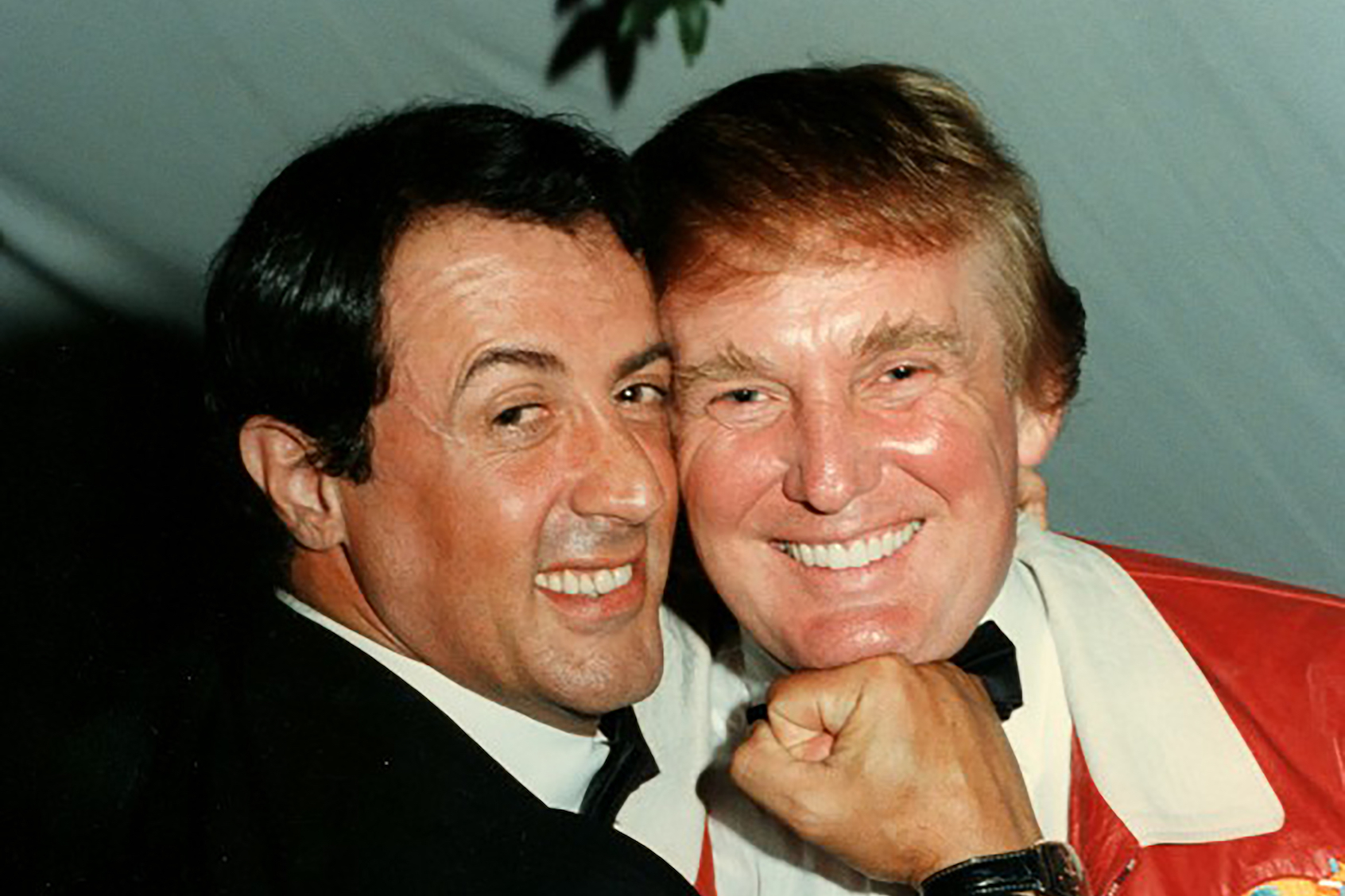 Actory Sylvester Stallone poses for a playful portrait with businessman Donald Trump at a lupus charity event held at Bud and Marla Paxon's home in Palm Beach, Florida, February 24, 1997. (Photo by Davidoff Studios/Getty Images)