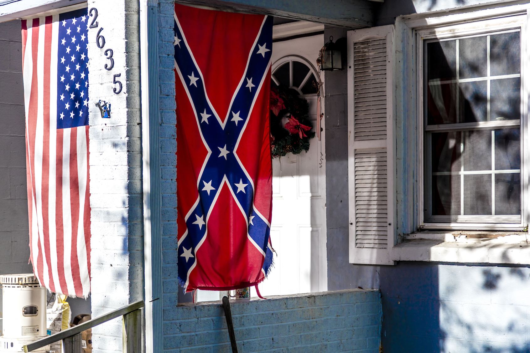 Confederate Flag Displayed With Us Flag On Front Porch Near Window, Backroads Of Virginia, October 26, 2016. (Photo by Joe Sohm/Getty Images)
