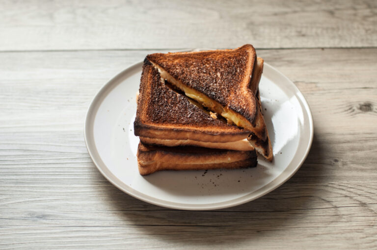 Burnt grilled cheese a la Nate's creation from "The Devil Wears Prada" (Karl Tapales / Getty Images)