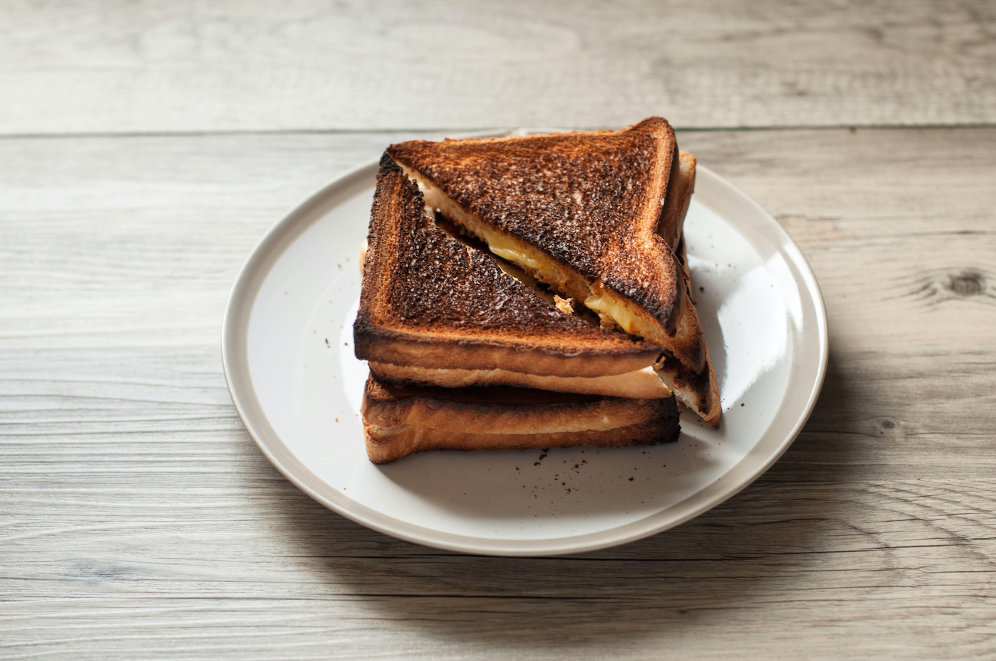Burnt grilled cheese a la Nate's creation from "The Devil Wears Prada" (Karl Tapales / Getty Images)