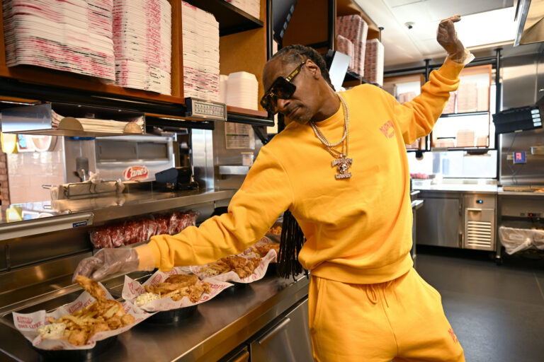 Snoop Dogg works a surprise "shift" at Raising Cane's in Vegas (Denise Truscello/Getty Images for Raising Cane's)