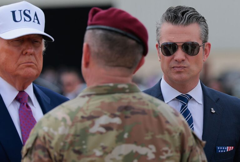 President Donald Trump and Secretary of Defense Pete Hegseth are greeted by 18th Airborne Corps Commander Lt. Gen. Gregory Anderson on June 10, 2025 at Fort Bragg, N.C. (Anna Moneymaker/Getty Images)